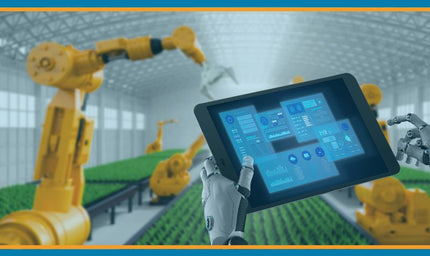 Robotic arms operate in a modern industrial facility while a robotic hand holds a tablet displaying IoT system data and analytics, representing connected automation and scalable industrial control.