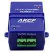 A blue AKCP DC-DC Converter module, model DCW024-5, with green +- terminal blocks for 5VDC output