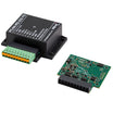 Two electronic components with 1 showing the outside black casing with green connectors and the other the inside green circuit board.