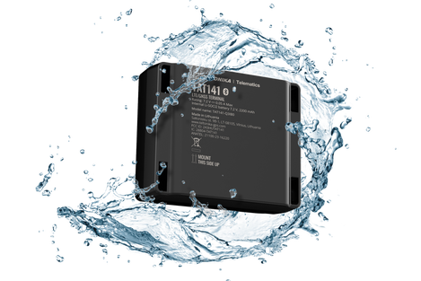 Black electronic TAT141 device with water splashes around it 