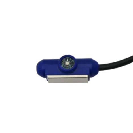 AKCP AQX4 air pollution and pressure sensor with blue housing, exposed sensor board, magnetic mounting bar, and black cable