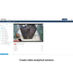 A screenshot of a video surveillance software interface showing a live feed from cameras labeled Quickline, with a sidebar menu and a central monitor window displaying a person standing in front of server racks.